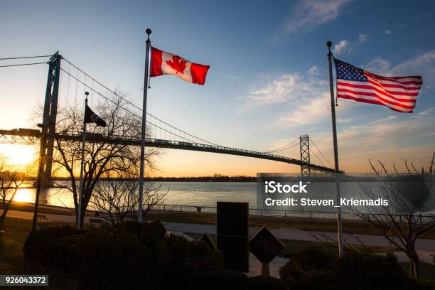 Ambassador Bridge With Flags Stock Photo - Download Image Now - Canada, USA, American Flag