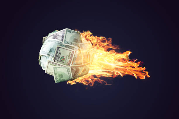 Fire money ball of dollar bills going up like a comet in space. Concept of the rapid development of financial profit stock photo