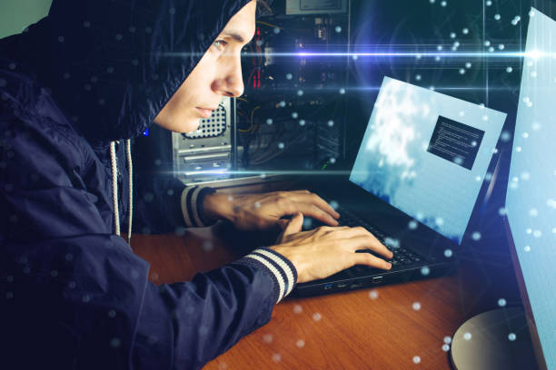 istock hacker in the dark breaks the access to steal information 926047896