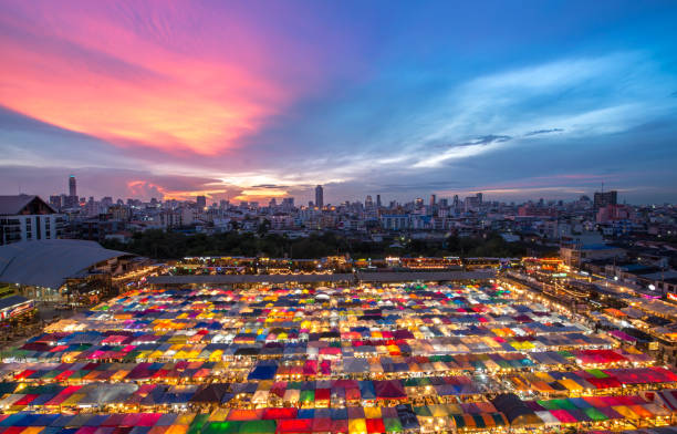 istock a colorful night market with beautiful sky 926051476