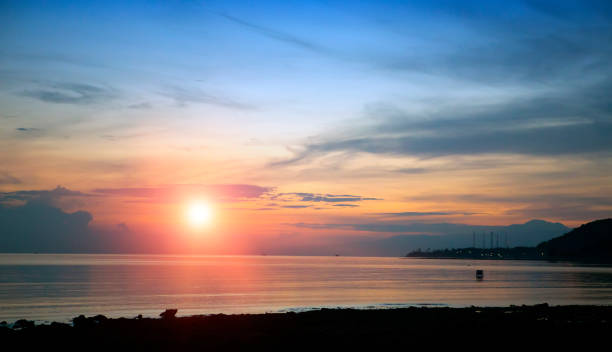istock Stony seacoast on a sunset. Indonesia. Bali. 926054308