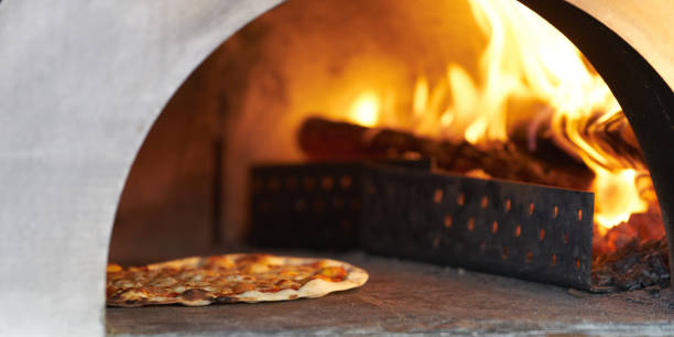 istock pizza in hot firewood Oven for cook 926058232