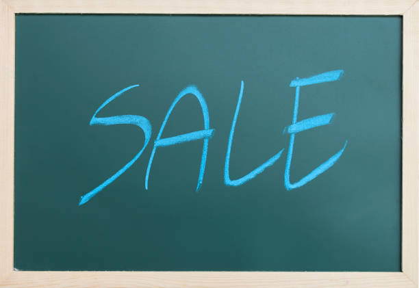 Blackboard with sale written on in white chalk