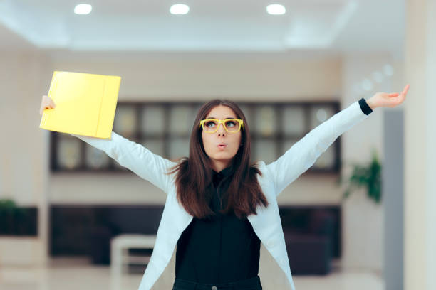Excited Business Women Holding Up Important Documents Funny enthusiastic female executive celebrating professional achievement quitting a job stock pictures, royalty-free photos & images