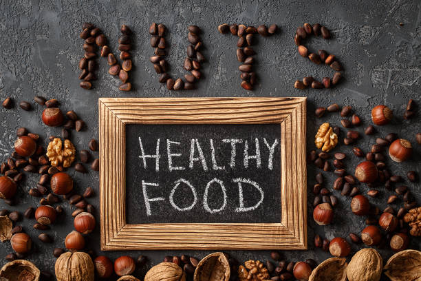 istock Inscription Healthy Food, from different nuts . space for text 926061900