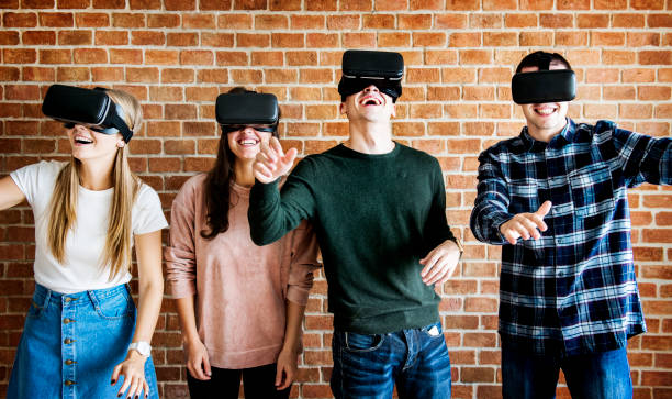 istock Friends trying on VR headsets 926061986