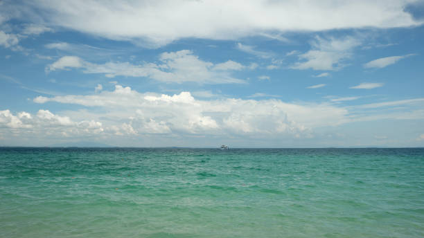 istock Blue sky and white clouds over the sea , summer vacation 926062498