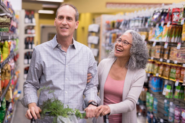 istock Senior Couple Grocery Shopping Together 926062906