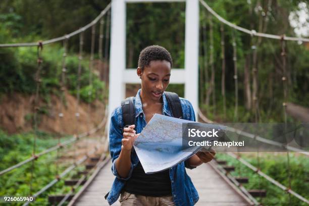 African American Woman Looking At A Map Travel And Explore Concept Stock Photo - Download Image Now