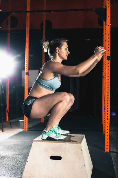 istock Attractive woman do sit-ups exercises. Workout exercise at gym class 926067138