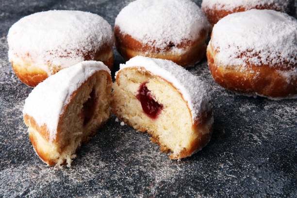 istock German donuts with jam and icing sugar. Carnival powdered sugar raised donuts 926075000