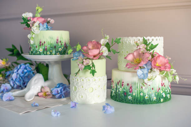 istock Wedding spring cake decorated with colorful flowers and hydrangeas. Desserts for a festive summer mood 926077104