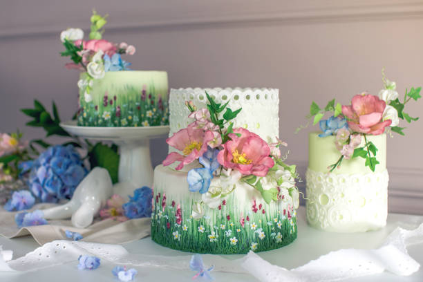 istock Wedding spring cake decorated with colorful flowers and hydrangeas. Desserts for a festive summer mood 926077106