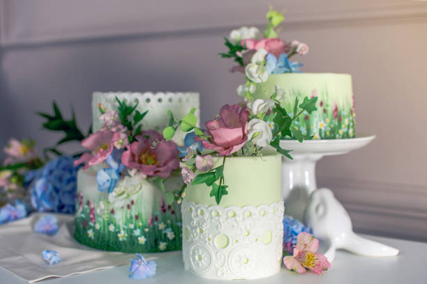 istock Wedding spring cake decorated with colorful flowers and hydrangeas. Desserts for a festive summer mood 926077124