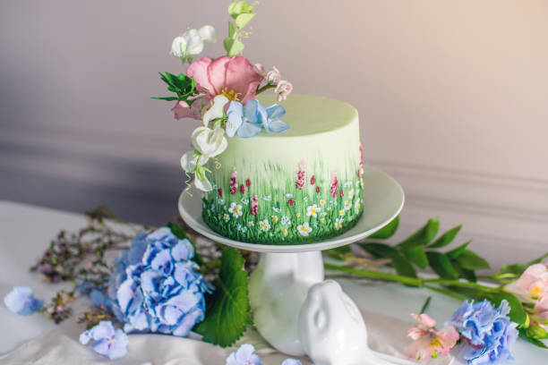 istock Wedding spring cake decorated with colorful flowers and hydrangeas. Desserts for a festive summer mood 926077130