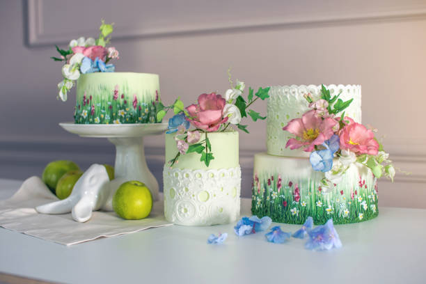 istock Wedding spring cake decorated with colorful flowers and hydrangeas. Desserts for a festive summer mood 926077134