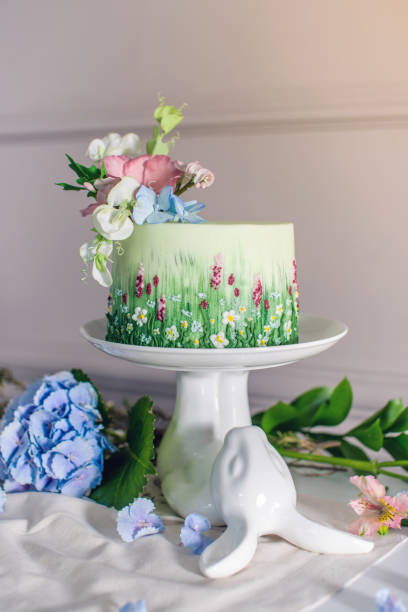 istock Wedding spring cake decorated with colorful flowers and hydrangeas. Desserts for a festive summer mood 926077140