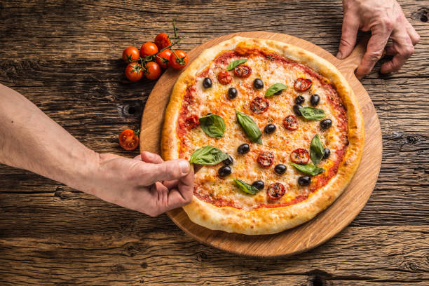istock Chef and pizza. Chef preparing pizza in hotel or restaurant 926077928
