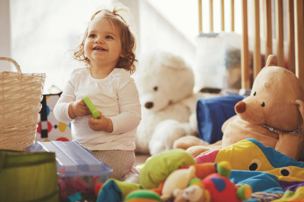 istock Joyful baby girl in playroom 926079146