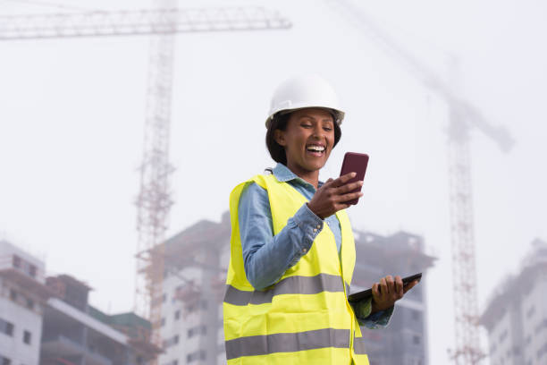 construction woman closing deal on the phone. - female construction telephone building contractor imagens e fotografias de stock