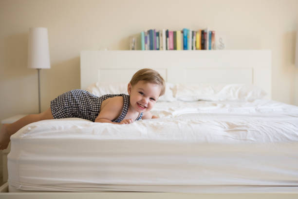 istock Toddler Boy Playing in Bed. 926084700