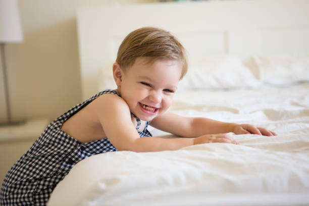 istock Toddler Boy Playing in Bed. 926084784
