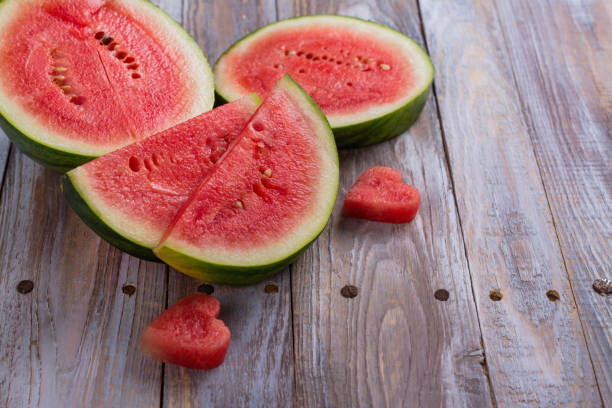 istock Fresh ripe watermelon slices and mint on wooden table 926084844