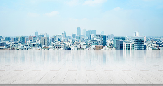 Business and design concept - empty stone panel ground with panoramic city skyline aerial view under bright sun and blue sky of nagoya, Japan for mockup or montage product