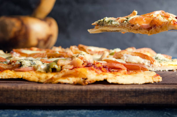 istock Pizza slice with tomato, chicken and blue cheese 926093442