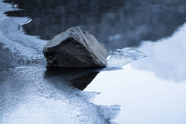istock close up on rocks isolated on a lake 926109014