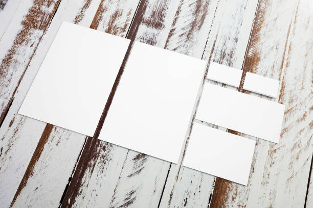 istock Blank stationery set on grunge wooden desks. 3d render. 926109774