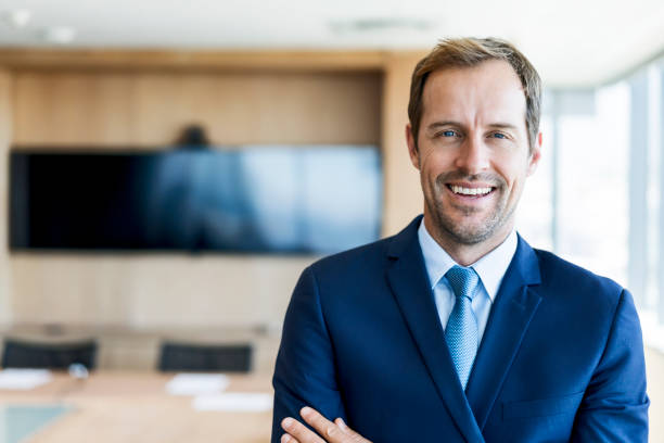 istock Confident businessman standing in board room 926109872