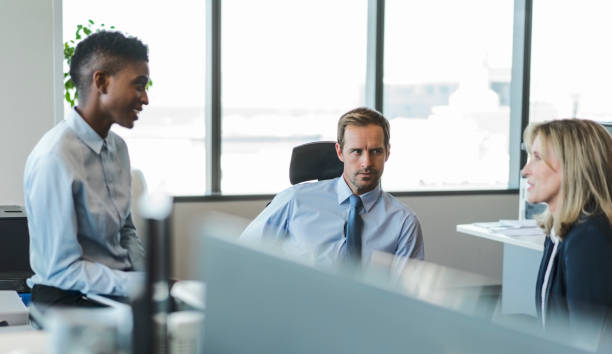 istock Businesswoman discussing with colleagues at office 926110376