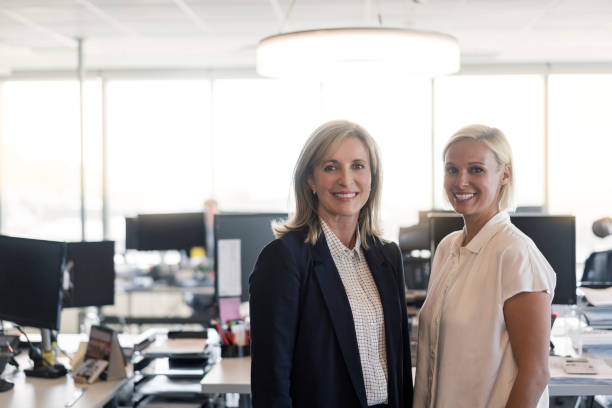 istock Confident businesswomen standing in office 926110484