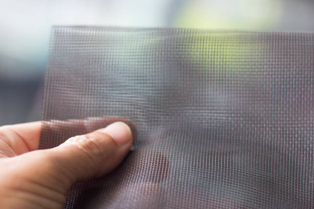mosquito nets - netting child mosquito netting window imagens e fotografias de stock