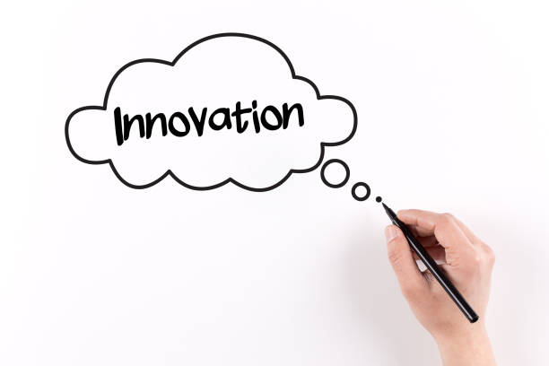 istock Hand writing Innovation on white paper, View from above 926113690