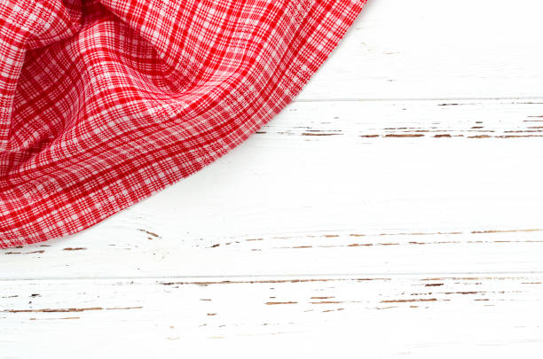istock red kitchen cloth on white vintage wooden table. copy space 926113748