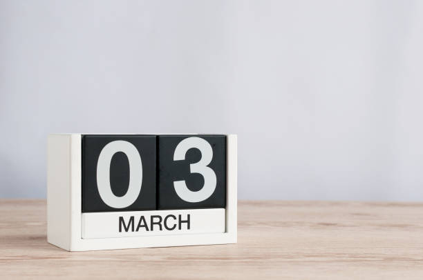 istock March 3rd. Day 3 of month, wooden calendar on light background. Spring time, empty space for text 926114258