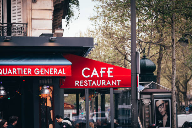 Cafe - Restaurant sign on street of Paris Paris, France - April 28, 2016: Entrance to Cafe, Restaurant text sign on red canopy in street of Paris France cafe france italy stock pictures, royalty-free photos & images