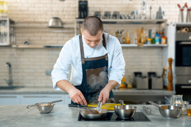 istock Chef is stirring vegetables in wok. cooking process 926120268