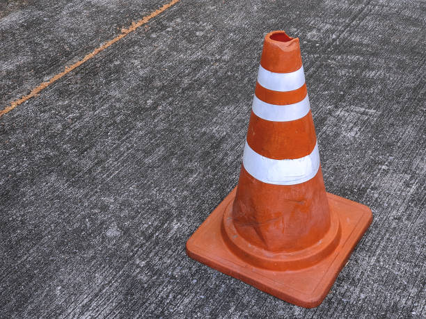 istock Orange Road Traffic Cone with White Stripes on Street 926120920