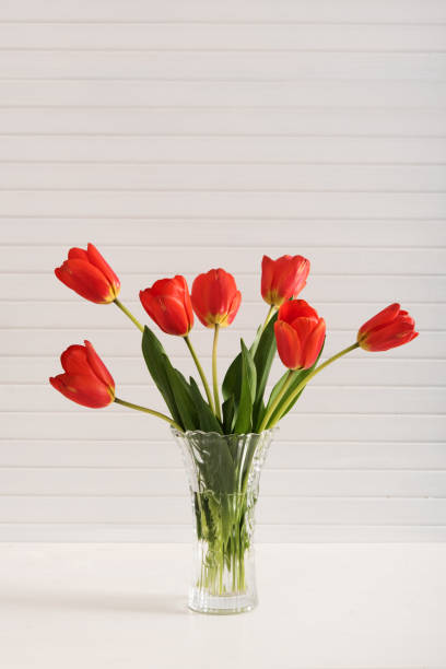 istock Colorful tulips on wooden table 926123792
