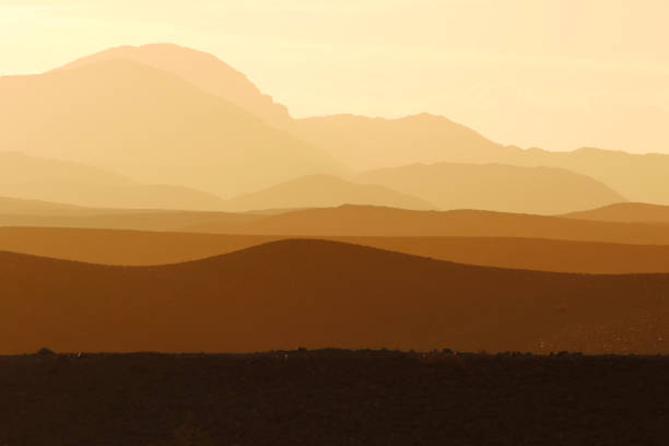 Landscape rolling hills mountains valleys sunset dawn dusk dust desert
