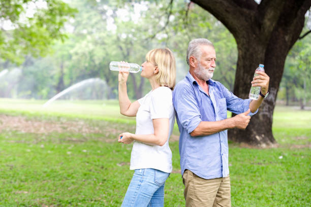 istock Portrait senior couple standing drinking water 926131984
