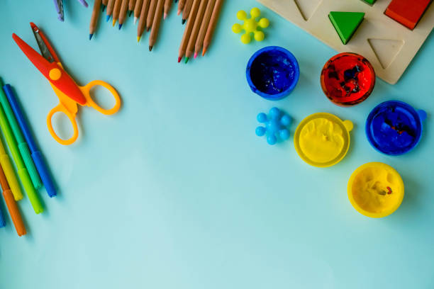 istock Top view on colorful paints and brushes. Creative ideas, creativity and early learning. Education concept. 926140042
