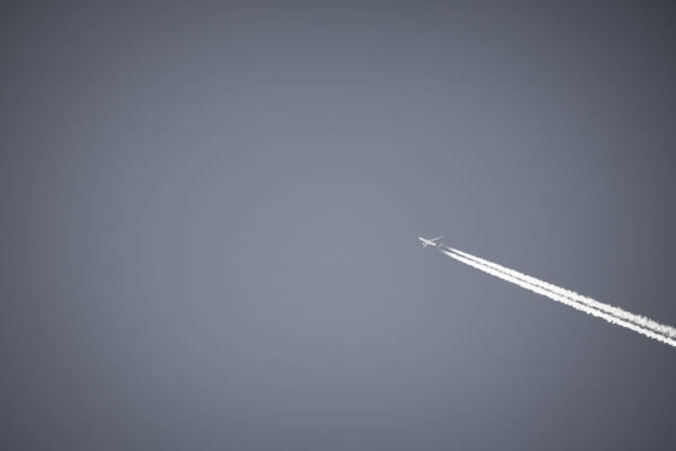 istock plane flying high above in sky, travel concept 926140390