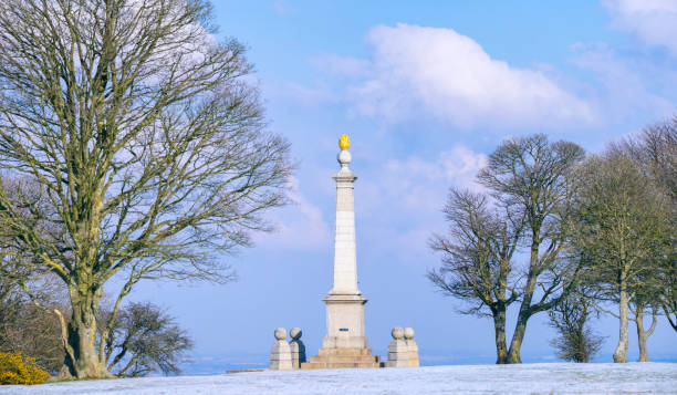 A thin dusting of snow falls near the war memorial on Coombe Hill in Buckinghamshire.