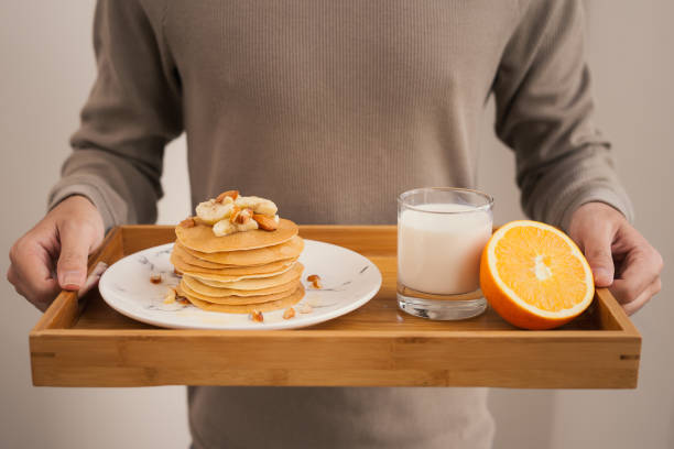 istock Serve breakfast. Banana pancakes with honey and nuts 926144390
