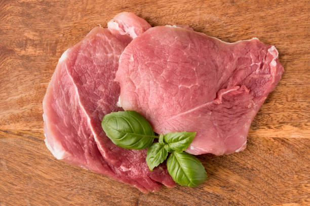 istock pork shoulder on a wooden mango board 926144592