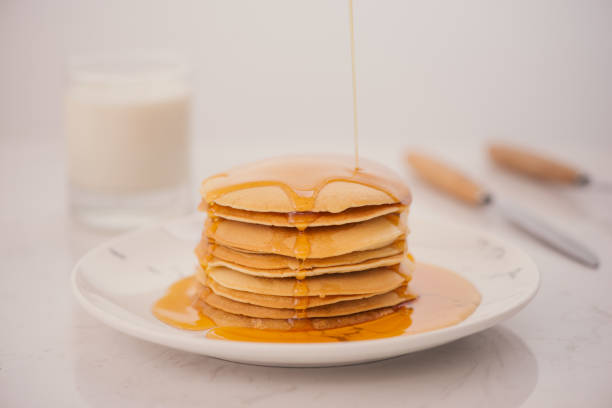 istock Pancakes for breakfast with honey and milk. 926144808